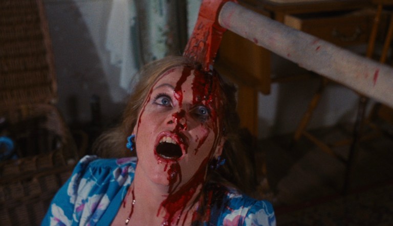 May Heatherly gets an axe to the head in Pieces (1982).