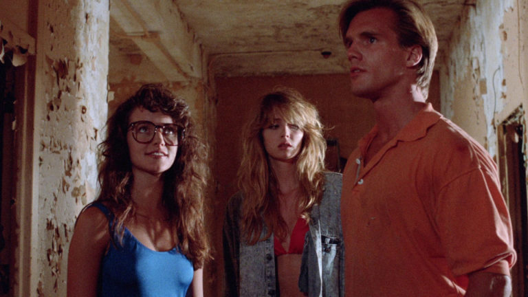 Kristin Davis, William Hay, and Patty Mullin in Doom Asylum (1988).
