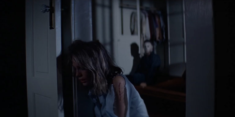 The Shape behind Laurie Strode (Jamie Lee Curtis) in Halloween (1978).