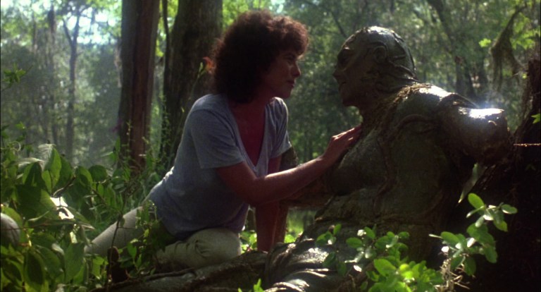 Adrienne Barbeau and Dick Durock in Swamp Thing (1982).