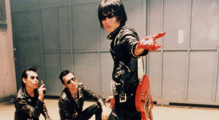 Guitar Wolf, Drum Wolf, and Bass Wolf in Wild Zero (1999).