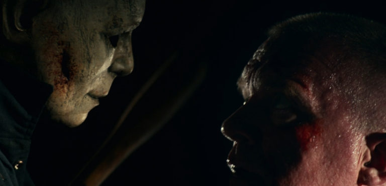 The Shape overtakes Tommy Doyle in Halloween Kills (2021).