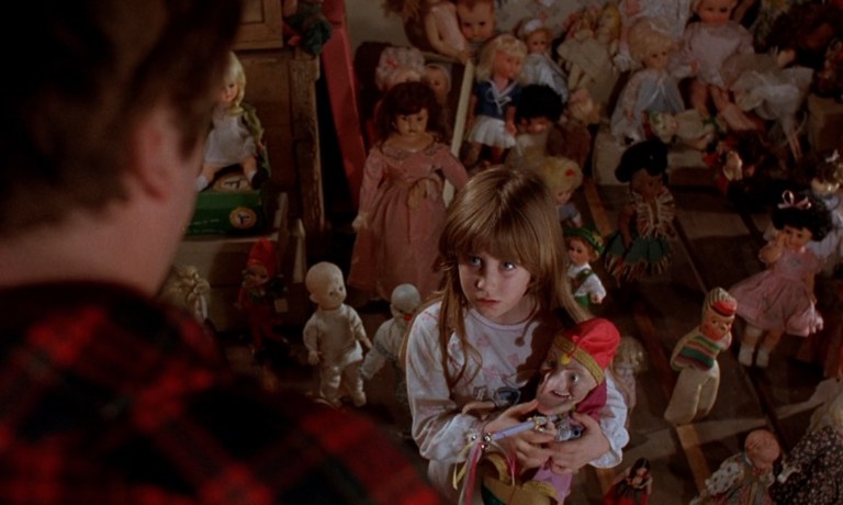 A room full of evil dolls in Dolls (1987).