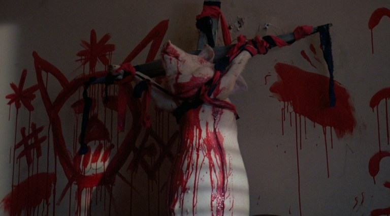 A crucified pig in The Serpent and the Rainbow (1988).