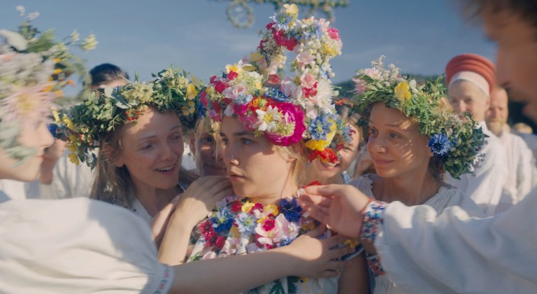 Florence Pugh is covered in flowers in Midsommar (2019).