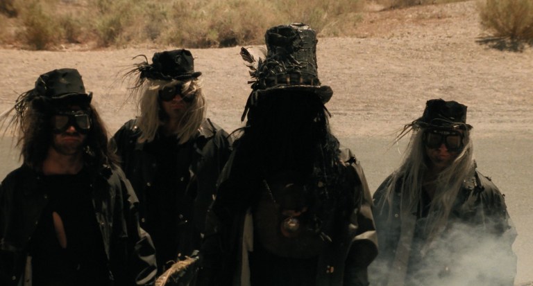 Death and his heavy metal band in Six-String Samurai (1998).