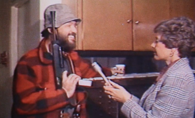 James Hoskins speaks to reporter Elaine Green in The Killing of America (1981).