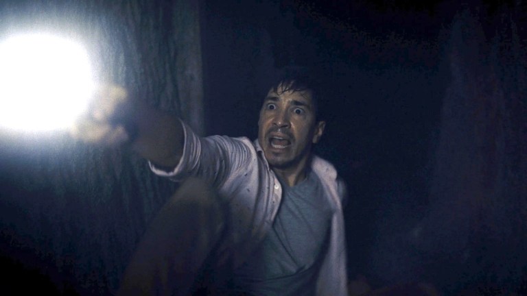 Justin Long is scared in Barbarian (2022).