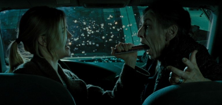 Mrs. Gannush is fought off by Christine in Drag Me to Hell (2009).