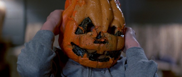 A kid dying in a jack-o-lantern mask in Halloween 3: Season of the Witch (1982).