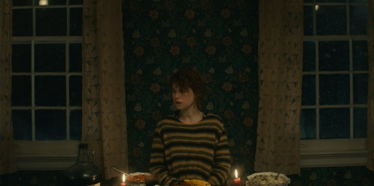 Jesse Buckley at a dinner table in I'm Thinking of Ending Things (2020).