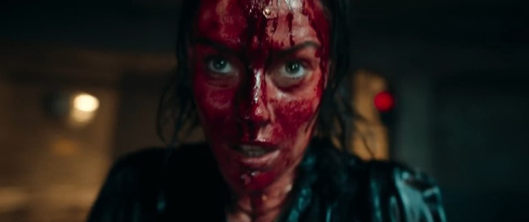 Beth is covered in blood in Evil Dead Rise (2023).