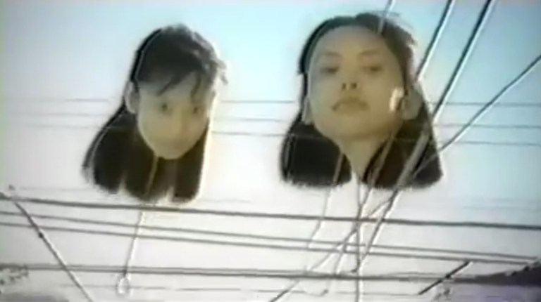 Two girl-headed balloons float in the story "Hanging Balloons" from the anthology film of the same title.