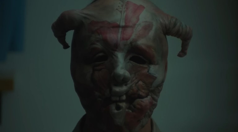 James wears a mask in Infinity Pool (2023).