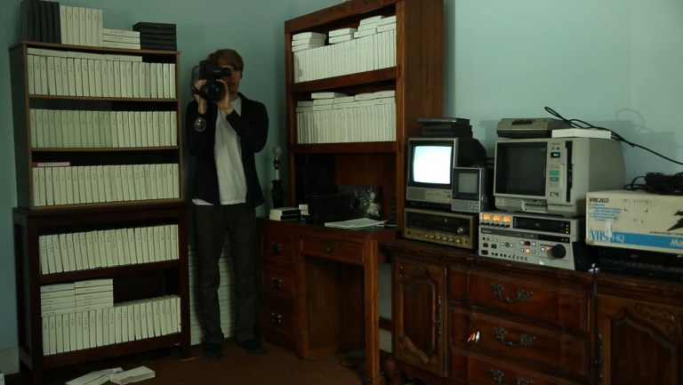 Paul Owens holds a VHS camera in LandLocked (2021)