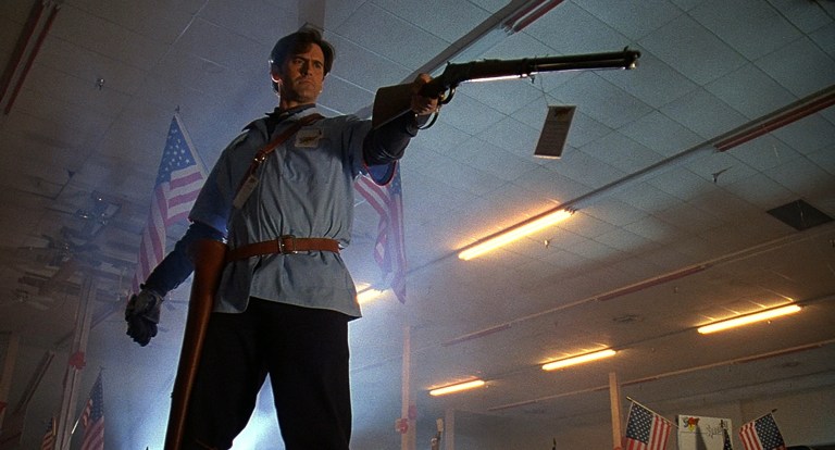 Ash holds a gun in S-Mart in Army of Darkness (1992).