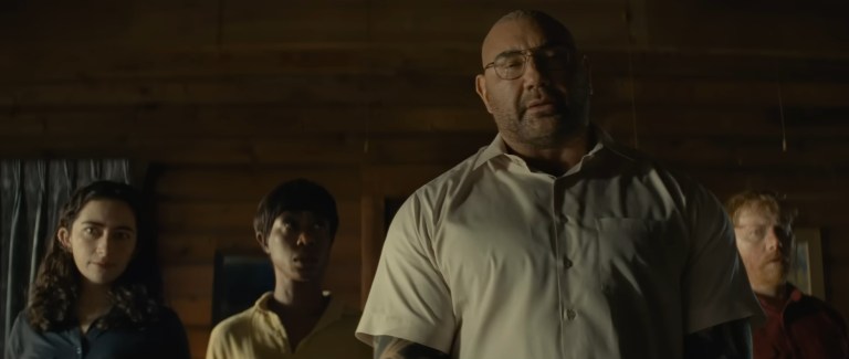Dave Bautista leads four strangers who impose an impossible choice on a family in Knock at the Cabin (2023).