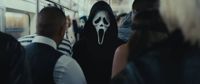 Ghostface stalks our heroes in a subway car in Scream VI (2023).