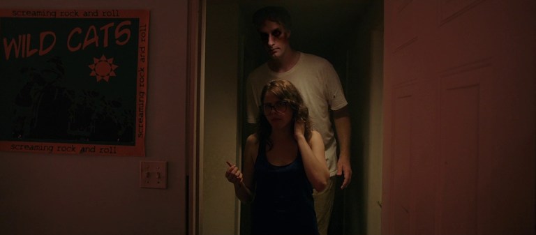 The entity in It Follows (2014) stands way too close to someone in a doorway.