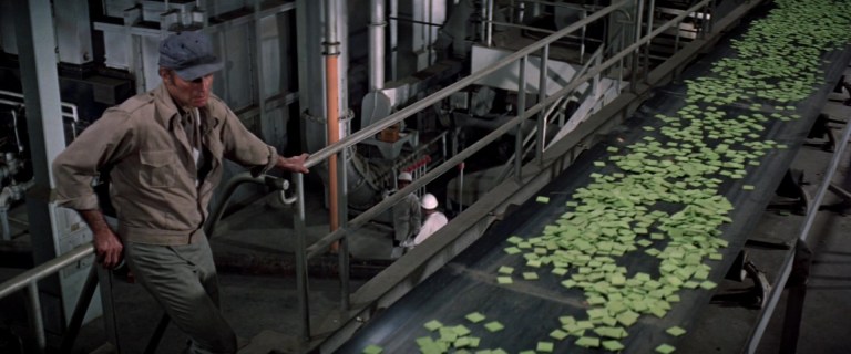 Charlton Heston looks at the titular food in Soylent Green (1973).