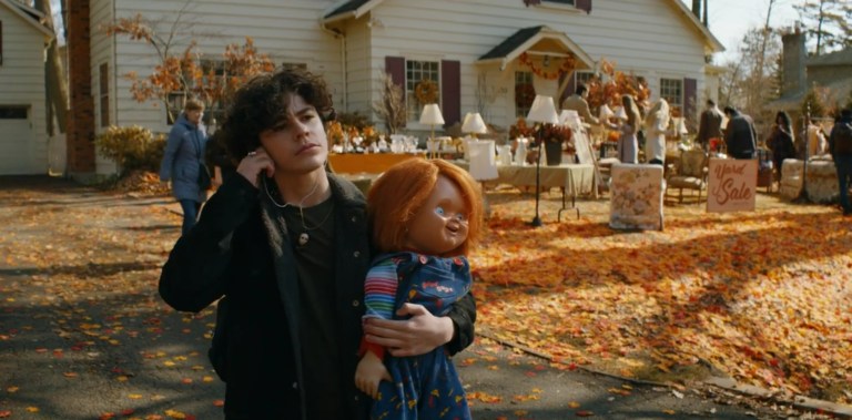 Jake carries Chucky away from a yard sale.
