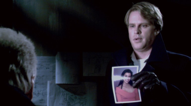 Dr. Gordon shows Jigsaw a picture of Lynn Denlon in Saw 3D (2010).