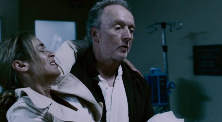 John Kramer tries to get Jill Tuck help in Saw IV (2007).