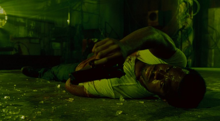 Rigg on the greound in Saw IV (2007).