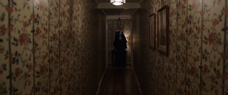 The nun is seen at the end of a hallway in both The Nun II (2023) and The Conjuring 2 (2016).