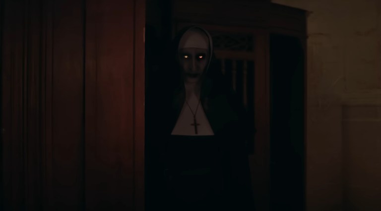 The demon nun Valak with glowing eyes in The Nun II (2023).