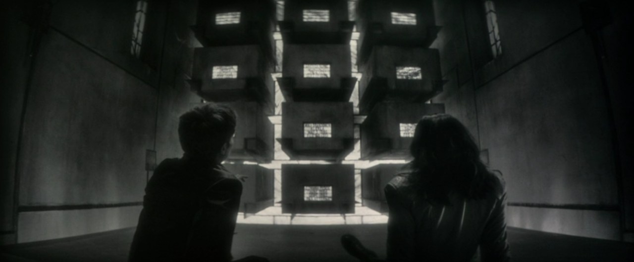 Jack and Elsa sit in a crypt in Werewolf by Night (2022).