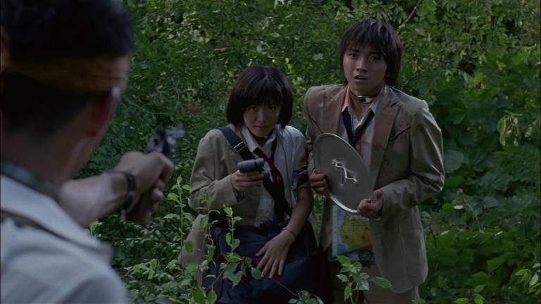 Aki Maeda and Tatsuya Fujiwara as Noriko and Shuya in Battle Royale (2000).