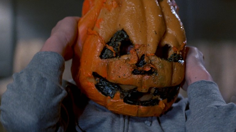 A kid in a jack-o'-lantern mask has a bad time in Halloween III: Season of the Witch (1982).
