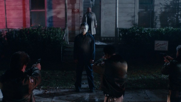 Michael Myers in a standoff with police in Halloween Kills (2021).