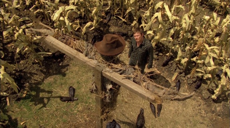 Norman Reedus looks up at  scarecrow in Messengers 2: The Scarecrow (2009).