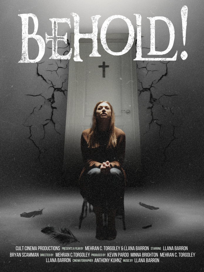 The poster for Behold! featuring a woman sitting in a chair in front of a white door that has a cross hanging on it.