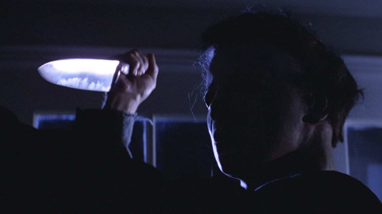 Michael Myers brandishes a kitchen knife in Halloween (1978).