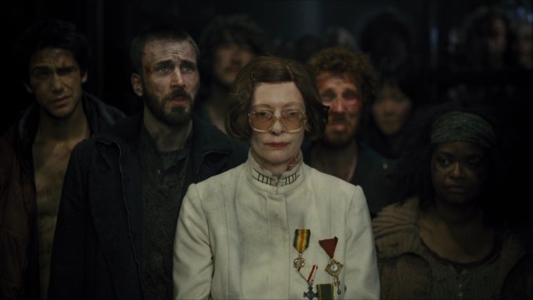 Luke Pasqualino, Chris Evans, Song Kang-ho, Tilda Swinton, Ewen Bremner, Ko Asung, and Octavia Spencer in Snowpiercer (2013).