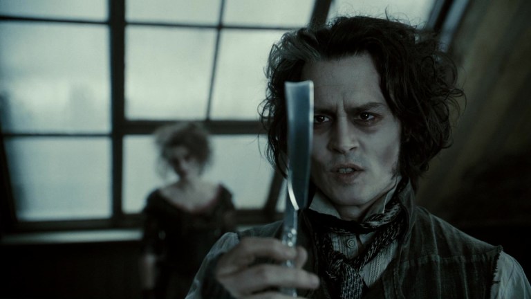 Johnny Depp as Sweeney Todd, singing to a razor.