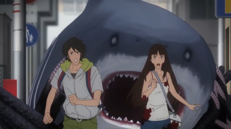 A monster shark chases two people through the streets of Tokyo in Gyo: Tokyo Fish Attack (2012).