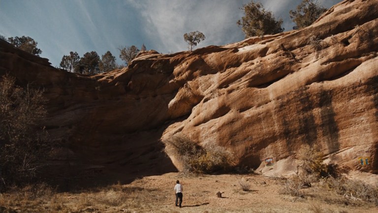 The rock walls of the canyon show how insignificant Wyndham is in The Seeding (2023).