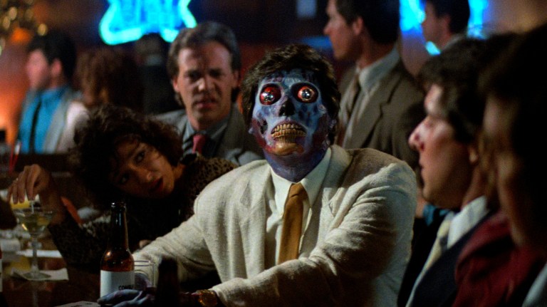 An alien sites among us in They Live (1988).