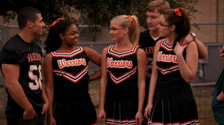 Cheerleaders and football players gather in Varsity Blood (2014).