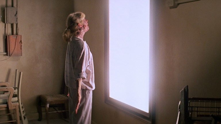Light shines from inside a mirror in Prince of Darkness (1987).