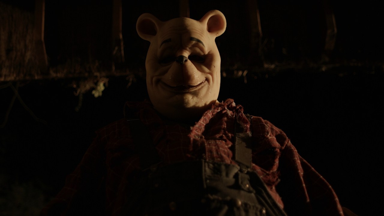 Pooh smiles in Winnie-the-Pooh: Blood and Honey (2023).