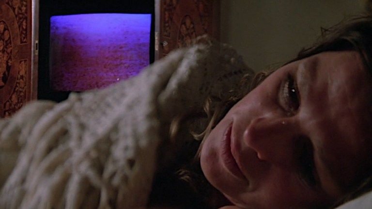 Susan listens to the AI program Proteus IV while trapped inside her home in Demon Seed (1977).