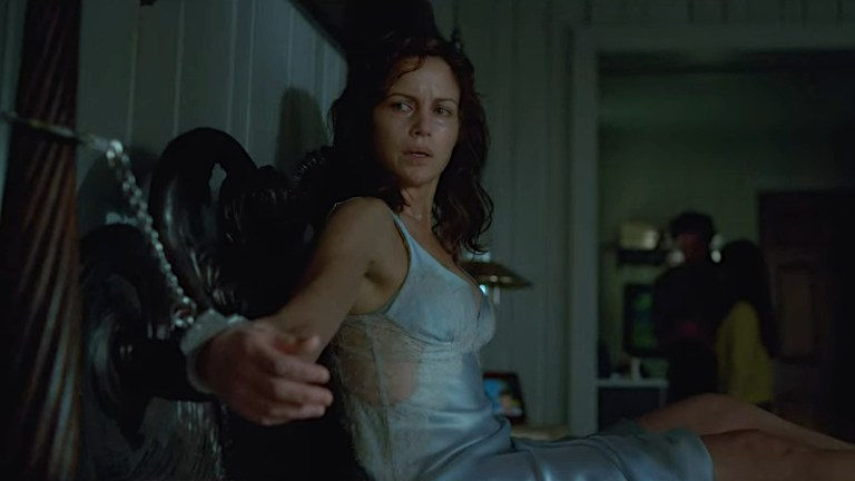 Carla Gugino handcuffed to a bed in Gerald's Game(2017).