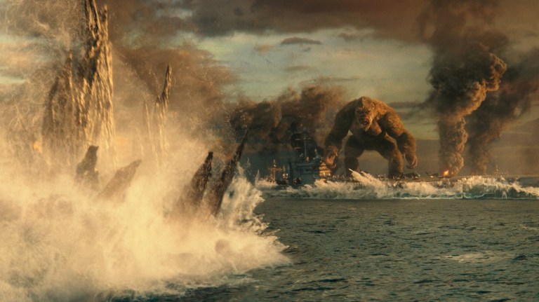 Kong stands on a ship in the ocean, waiting for Godzilla in Godzilla vs. Kong (2021).
