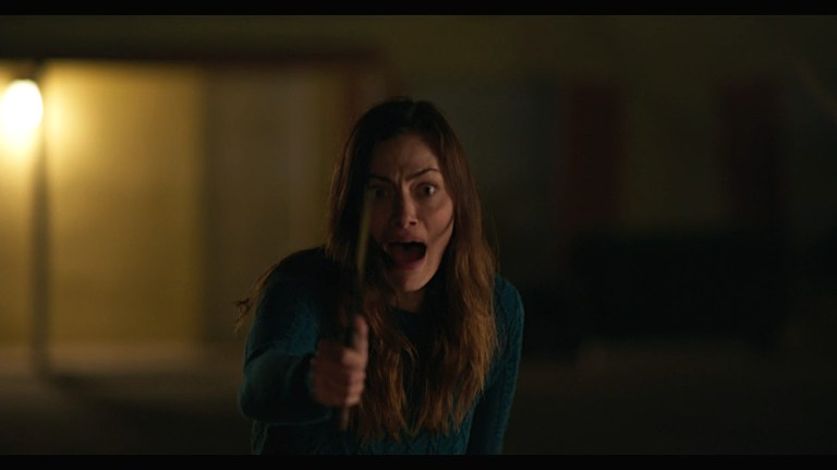 Gwen screams in the parking lot of a motel in Night Shift (2023).