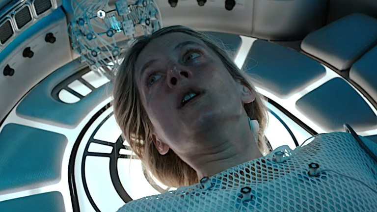 Liz tries to stay calm while trapped inside a cryogenic pod in Oxygen (2021).